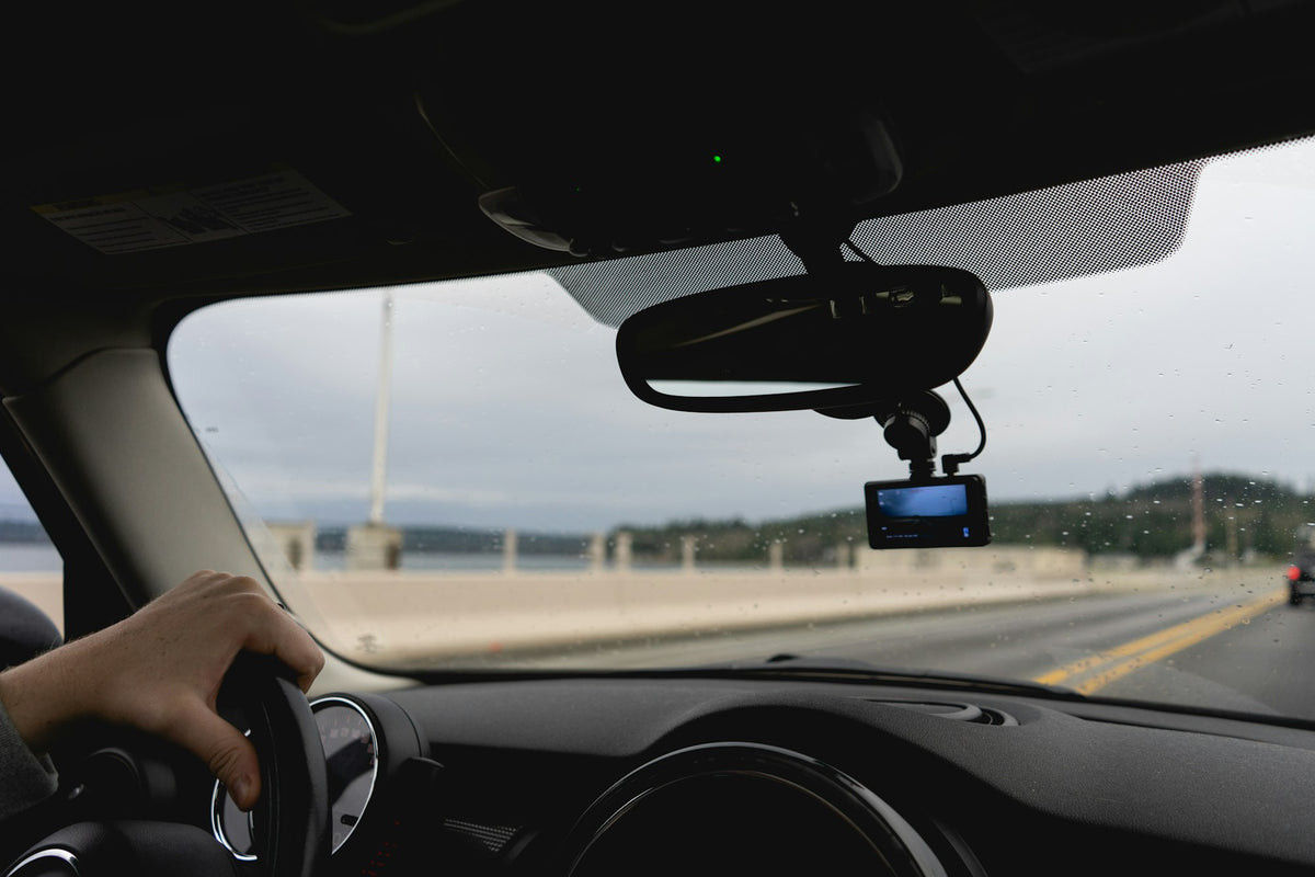 Dash cam mounted behind a windshield